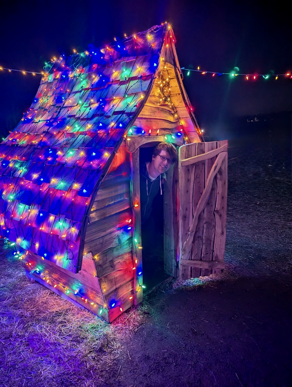 Me peeking out from a house at Winter Lights. Me peeking out from a house at Winter Lights.